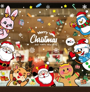 Detail of Christmas window stickers with Santa, reindeer, and gingerbread man motifs