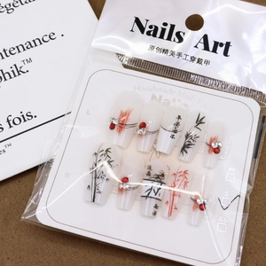 Chinese ink style press-on nails with bamboo art and rhinestones on display card