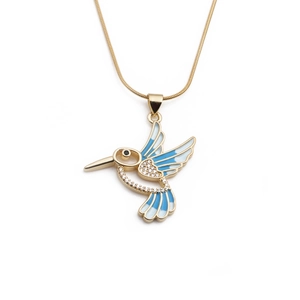 Golden hummingbird pendant necklace with blue enamel wings and sparkling cubic zirconia