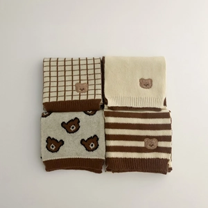Kids knitted bear scarf collection in cream and coffee tones with plaid and stripe patterns