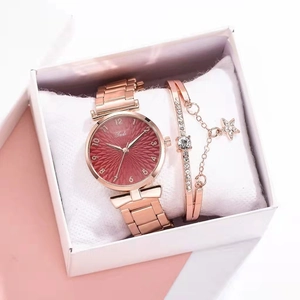 Elegant rose gold women's watch with red dial and matching star pendant bracelet set