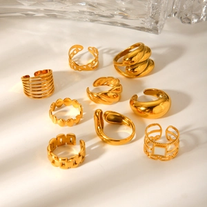 Set of 9 gold-plated geometric stainless steel rings in various textured designs
