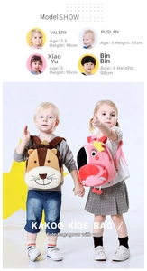 Close-up of plush cartoon animal backpacks with flamingo and lion designs for toddlers