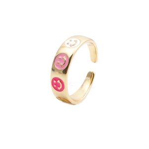 Creative adjustable gold ring with colorful enamel smiley faces on a white background