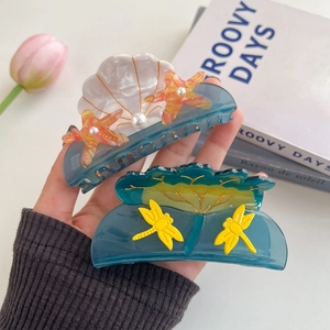 Acetate shell hair claw clips with starfish and dragonfly motifs for women's hairstyling