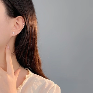 Elegant S925 sterling silver pig nose stud earrings and ear cuff on a female model