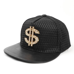 Detail of black snapback hat with mesh texture and gold rhinestone dollar sign badge