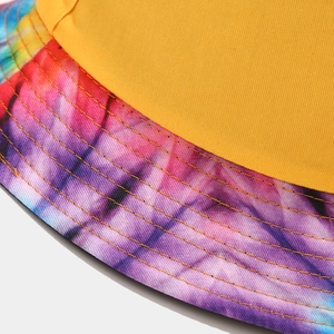Women's yellow tie-dye bucket hat with contrast stitching for outdoor sun protection