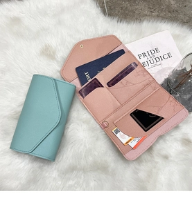 Detail view of the multi-slot interior of the faux leather passport wallet and card holder