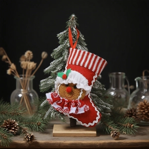 Classic red Christmas stocking with gingerbread man 3D doll and red hanging loop
