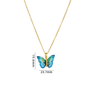 Golden butterfly necklace with gradient blue-green pendant and shiny foil details