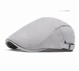 Detail view of breathable light gray mesh fabric beret with adjustable metal side buckle