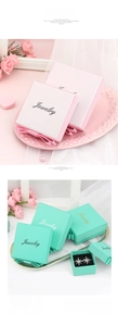 Detail of pink and blue jewelry gift boxes with silk ribbons and Jewelry lettering
