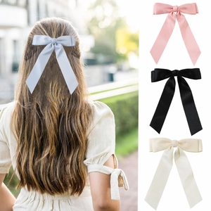 Elegant long ribbon bow hair clip for women in pastel blue pink black and beige colors