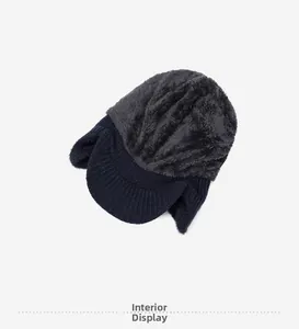 Detail view of the warm gray plush lining and blue knit fabric of the winter earflap hat