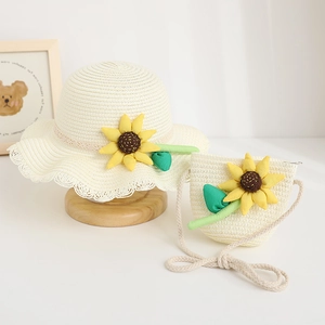 Kids cream straw hat and matching crossbody bag set with decorative sunflower accents