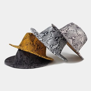 Detailed view of four wool fedora hats with stylish snakeskin patterns and flat brims