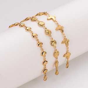 Three gold-plated stainless steel bracelets with heart, shell, and butterfly motifs hanging