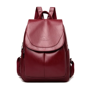 Elegant wine red leather backpack for women with flap design and a polished finish