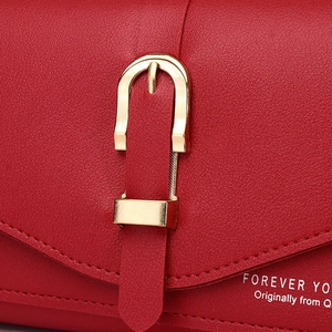 Red lychee grain leather crossbody phone bag with gold horseshoe buckle closure