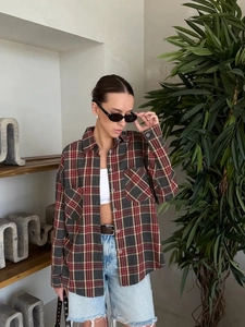 Detail of vintage plaid shirt showing the lapel collar and front button-down pockets