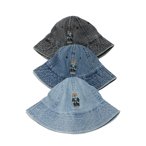 Denim bucket hat with bear embroidery in dark grey, medium blue, and light blue shades