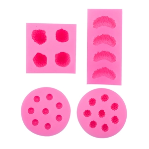 Pink silicone fruit molds for strawberry and raspberry fondant cake decoration