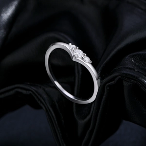 Elegant S925 sterling silver V-shaped ring with three round cut Moissanite stones on black leather