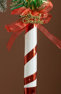 Detail of 30cm candy cane with red white spiral and golden Merry Christmas sign