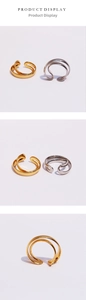 Detailed close-up showing the double-layered irregular gold and silver minimalist open rings