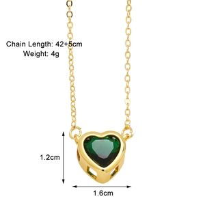 Close-up of green heart-shaped gemstone pendant with golden chain and size marking