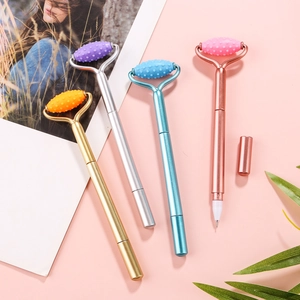 Creative massage gel pens with silicone rollers in four metallic colors on pink background