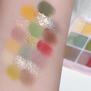 Arm swatches of 18-color eyeshadow palette with matte and shimmer glitter textures