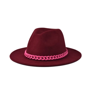 Close-up of wine red fedora hat featuring a vibrant neon pink plastic chain decoration