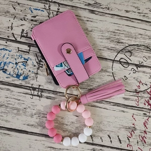 Pink faux leather card holder with matching silicone bead bracelet and tassel keychain