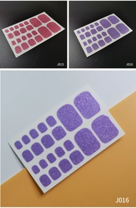 Detail of pink and purple glitter toe nail stickers with 22 pieces in various sizes
