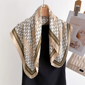Classic checkered silk scarf in beige and green featuring luxury chain pattern design