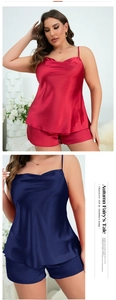 Close-up of glossy silk-like fabric on plus size red and navy blue pajama sets