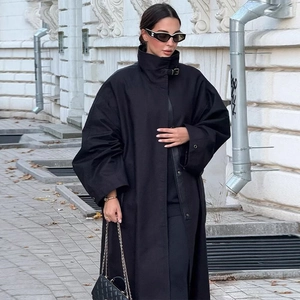 Long black minimalist trench coat with stand-up collar and loose urban streetwear fit