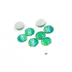 Detailed view of iridescent fish scale resin cabochons with silver flat back for DIY