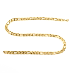 Detail of golden Figaro chain necklace with three-plus-one link pattern on white background