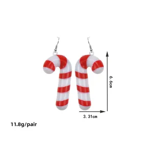 Detail view of red and white candy cane Christmas earrings with size and weight specs