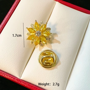 Detailed view of sunflower brooch with yellow zircon petals and 1.7cm size specs