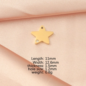 Detailed specs for gold star pendant with zircon, size 11x12.6mm on pink silk background