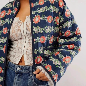 French vintage navy quilted floral jacket with orange print and padded texture detail