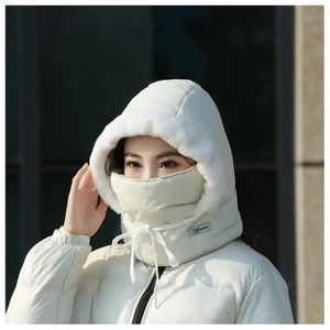 Detail of warm winter trapper hat with soft white faux fur trim and adjustable drawstrings