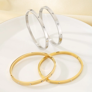 Elegant 18k gold and silver plated stainless steel oval bangles with shimmering crystals