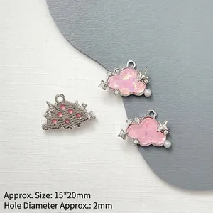 Detail of pink resin cloud pendant with silver alloy frame and rhinestones for DIY