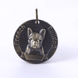 Detail of bronze bulldog pet ID tag with embossed design and engravable blank bar