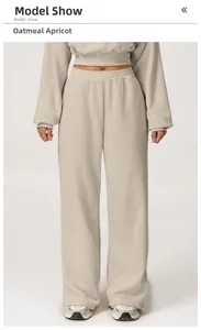 Detailed close-up of the oatmeal apricot high-waist joggers fabric and soft texture